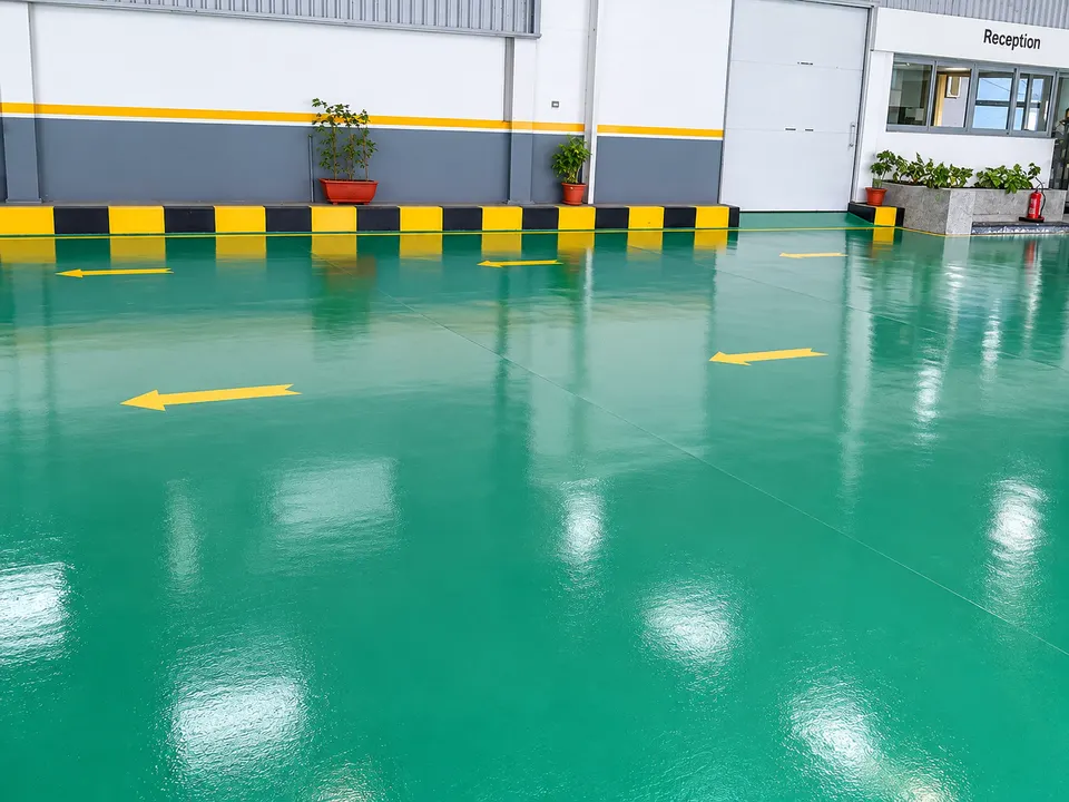 Green resin floor at automotive/service facility