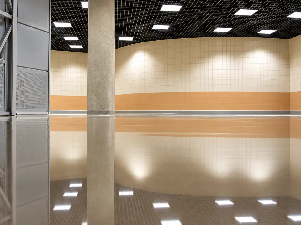 Reflective brown/bronze seamless floor in interior hall