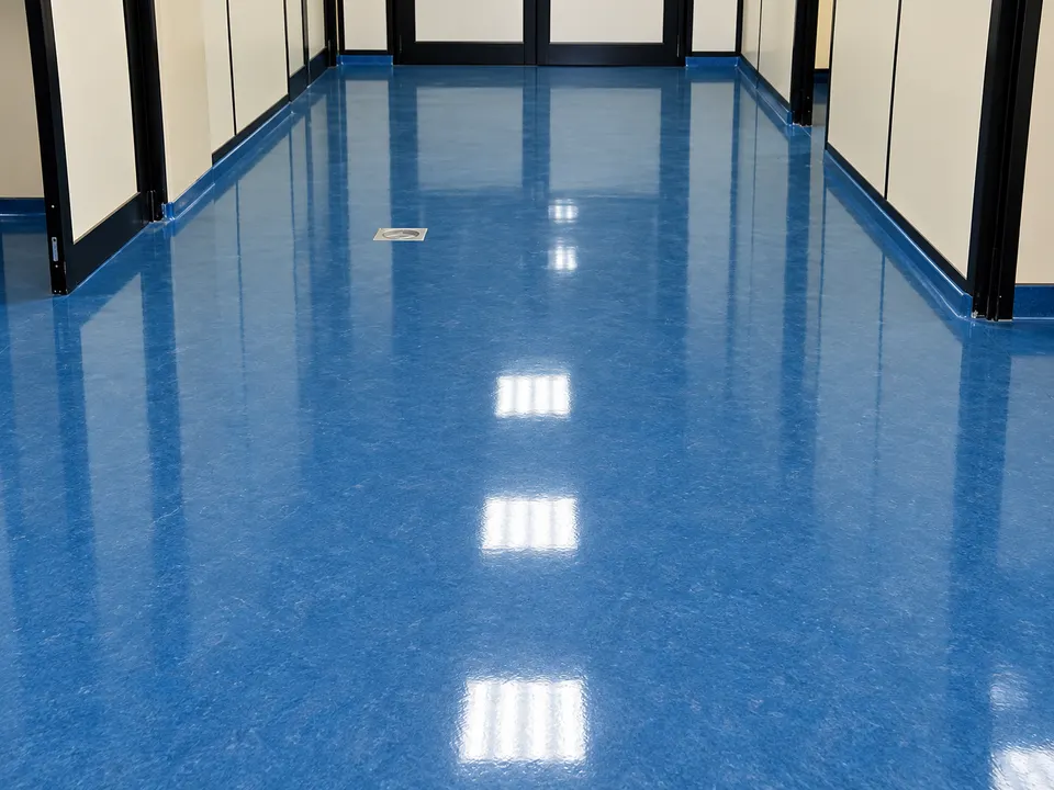 Blue glossy corridor floor in clean facility