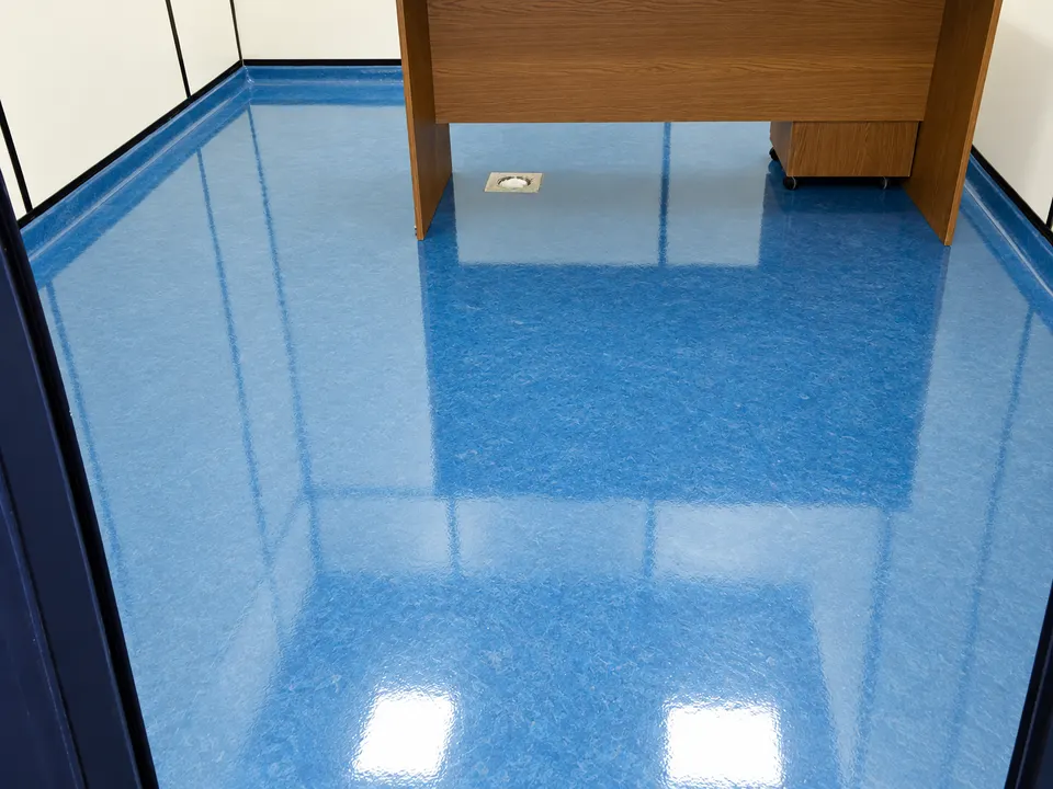 Blue glossy floor in small office/technical room